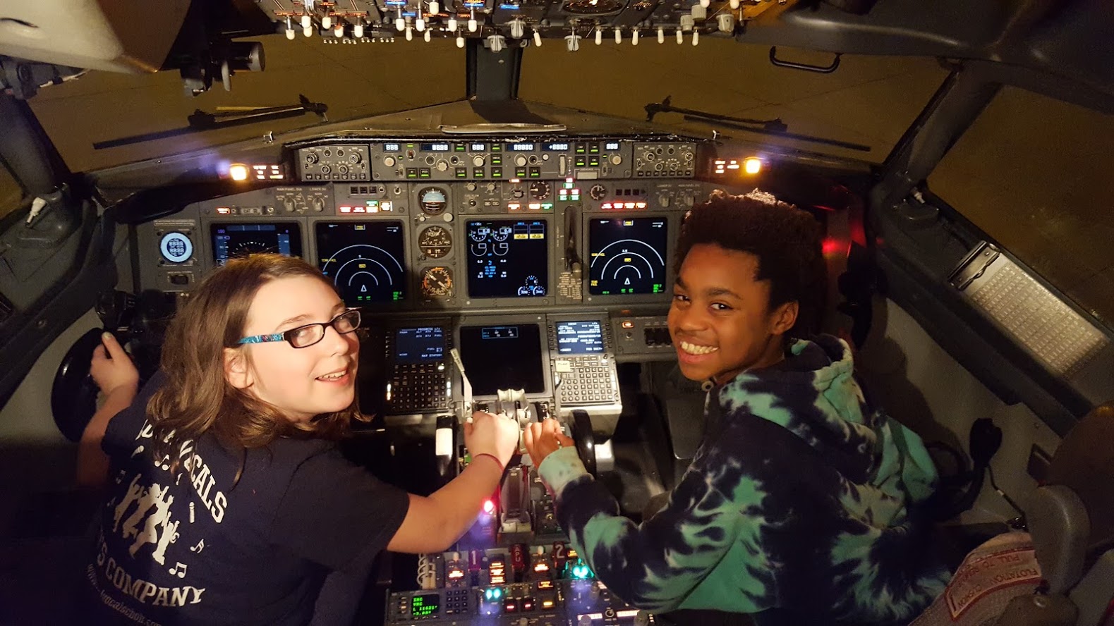 Abbie and Luke enjoying the view of the cockpit.