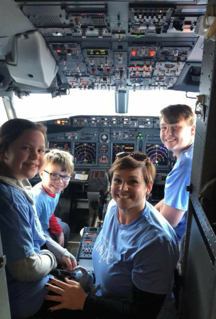 The Linden family enjoying the opportunity to see the cockpit.