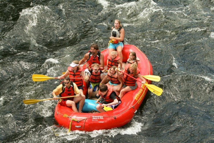 The Heinzelman Family rafting with the Milligan Family