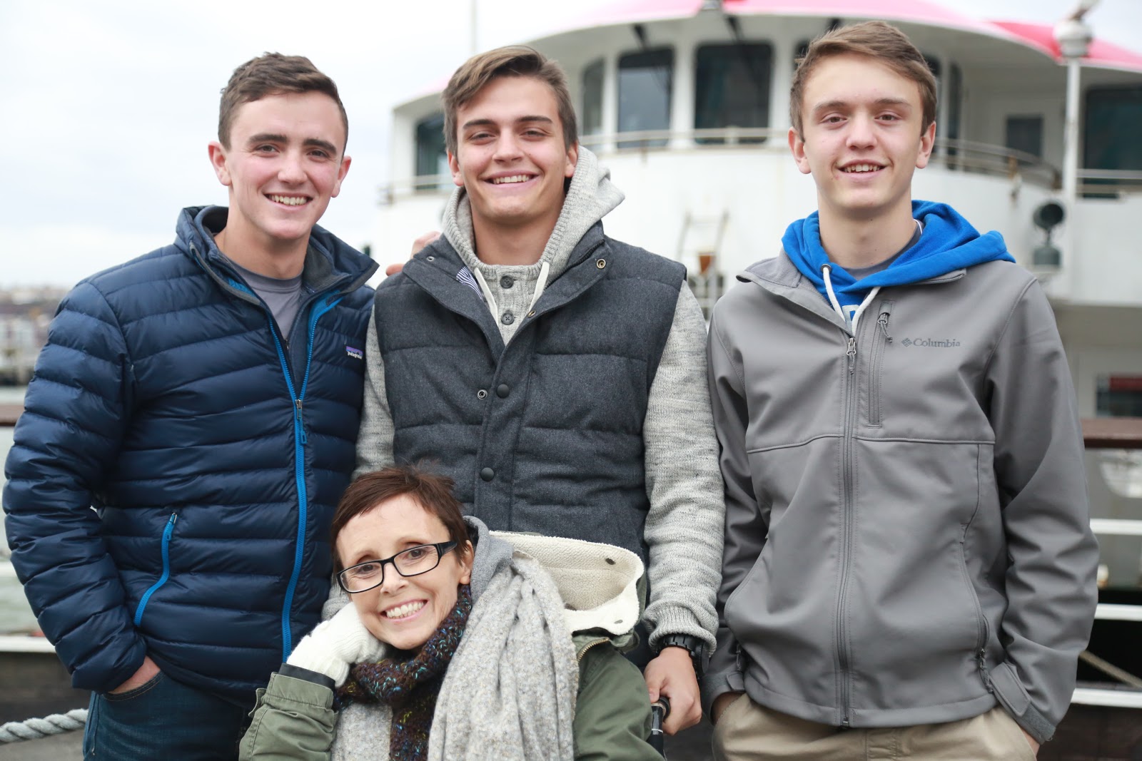 Stephen (left) with his mom and brothers at their NYC Legacy RetreatⓇ