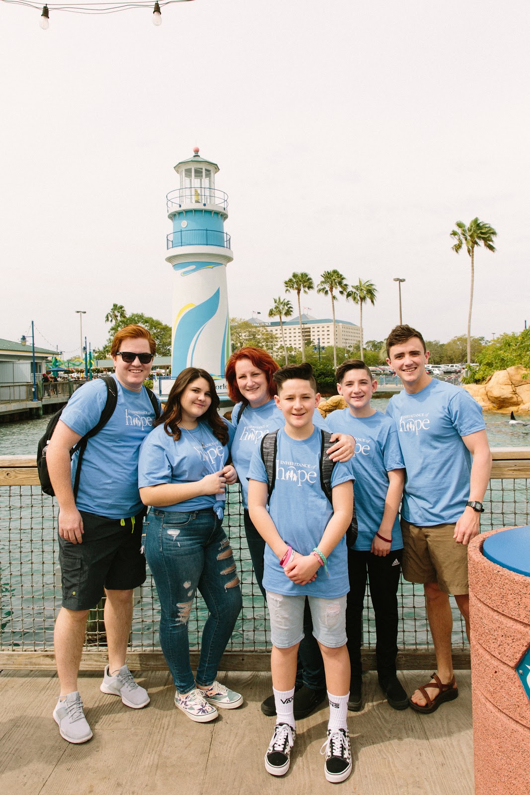 Stephen (right) paying it forward to another family in Orlando