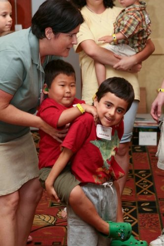 Counselor Meg Hill with Jakob and Tae during their children’s group time