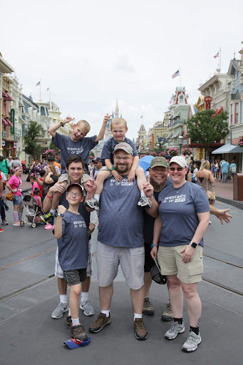 Isaiah (left) paying it forward to the Becker Family