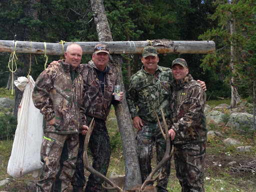 Admiring their hunting buddy’s elk, but none for the Lewis brothers on this trip