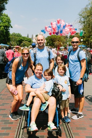 Jon (right) paying it forward to other families in California