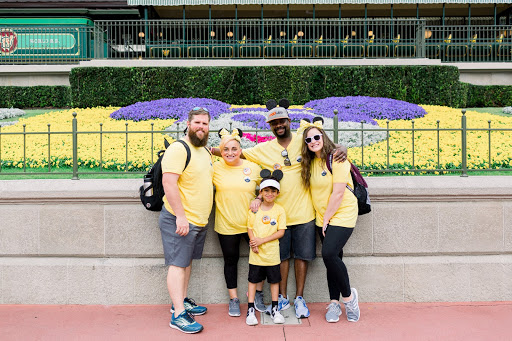 Katelyn (right) having fun volunteering with another family at Disney