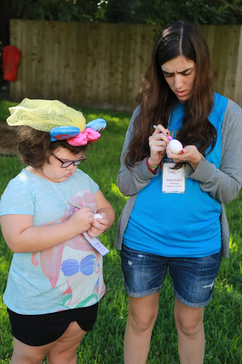 Anna and a friend prepare to smash eggs and worries