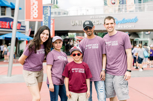 Ally Dee (left) joins with IoH COO Aaron Hedges (right) to serve a family in Orlando