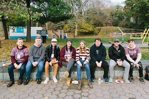 Noah, second from left, takes a break from ice skating in Central Park with other young adults all affected by the terminal illness of a parent.