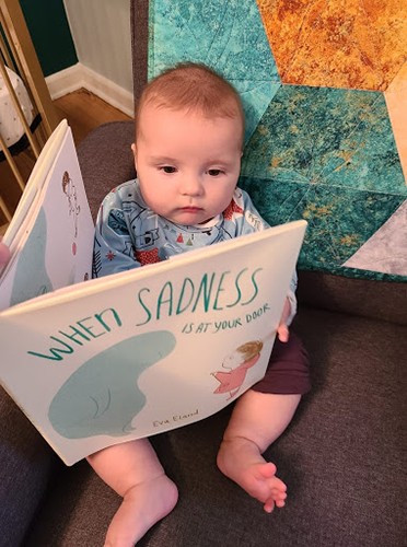 Elliot’s personal library boasts books which promote the normalization of feelings.  Erica, a school social worker, explains that as the child of a parent with a terminal illness, Elliot must always know that any feelings she has are ok.   Photo credit: Halli Lannan