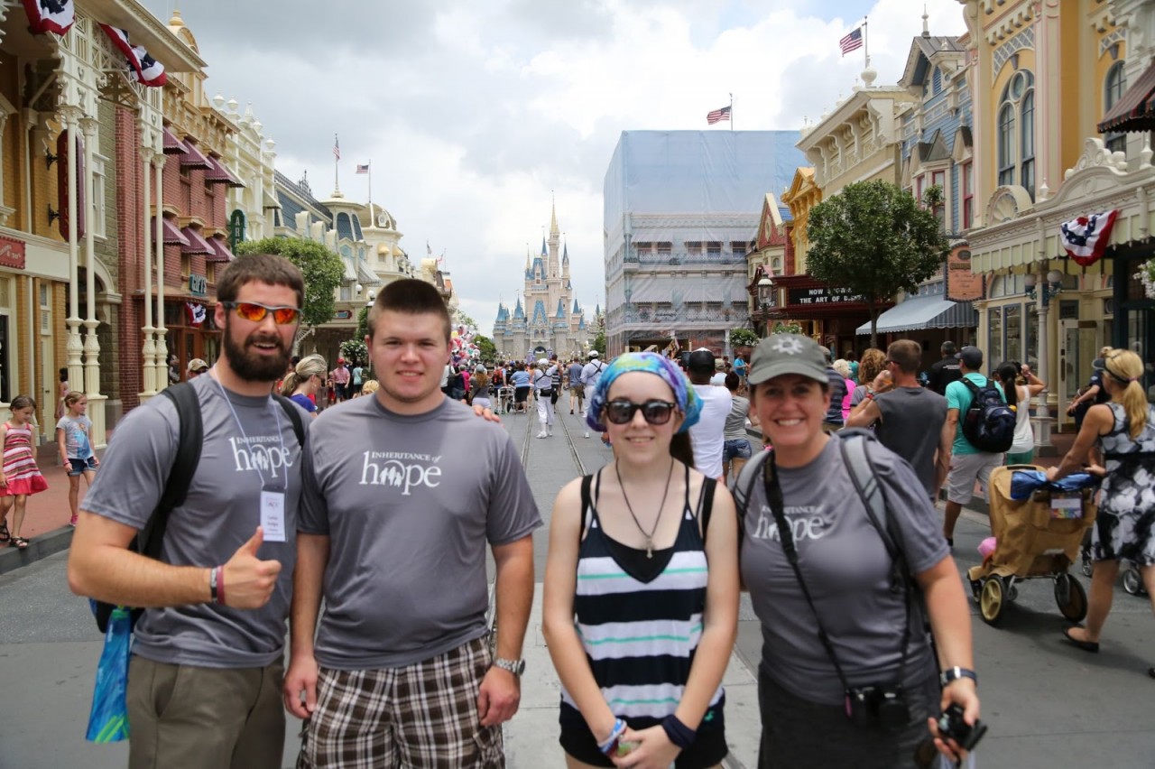 Jacob and Emily (middle) enjoying Magic Kingdom with IoH volunteers