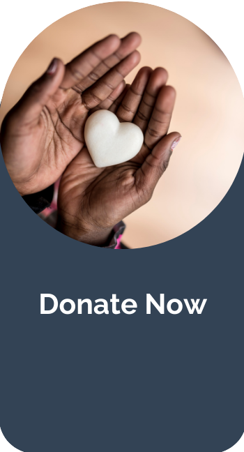 Image of hands holding a white heart shae with text below "donate now'.