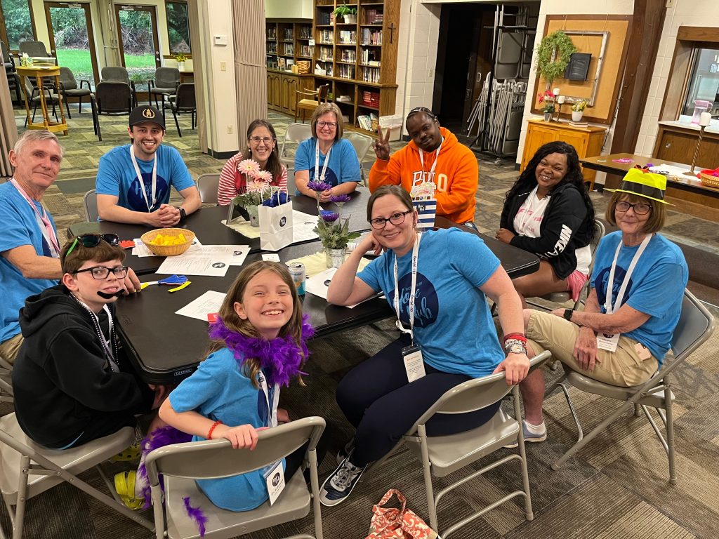 Image of 10 people sitting at a table at a Hope Hub™ Twin Cities gathering.