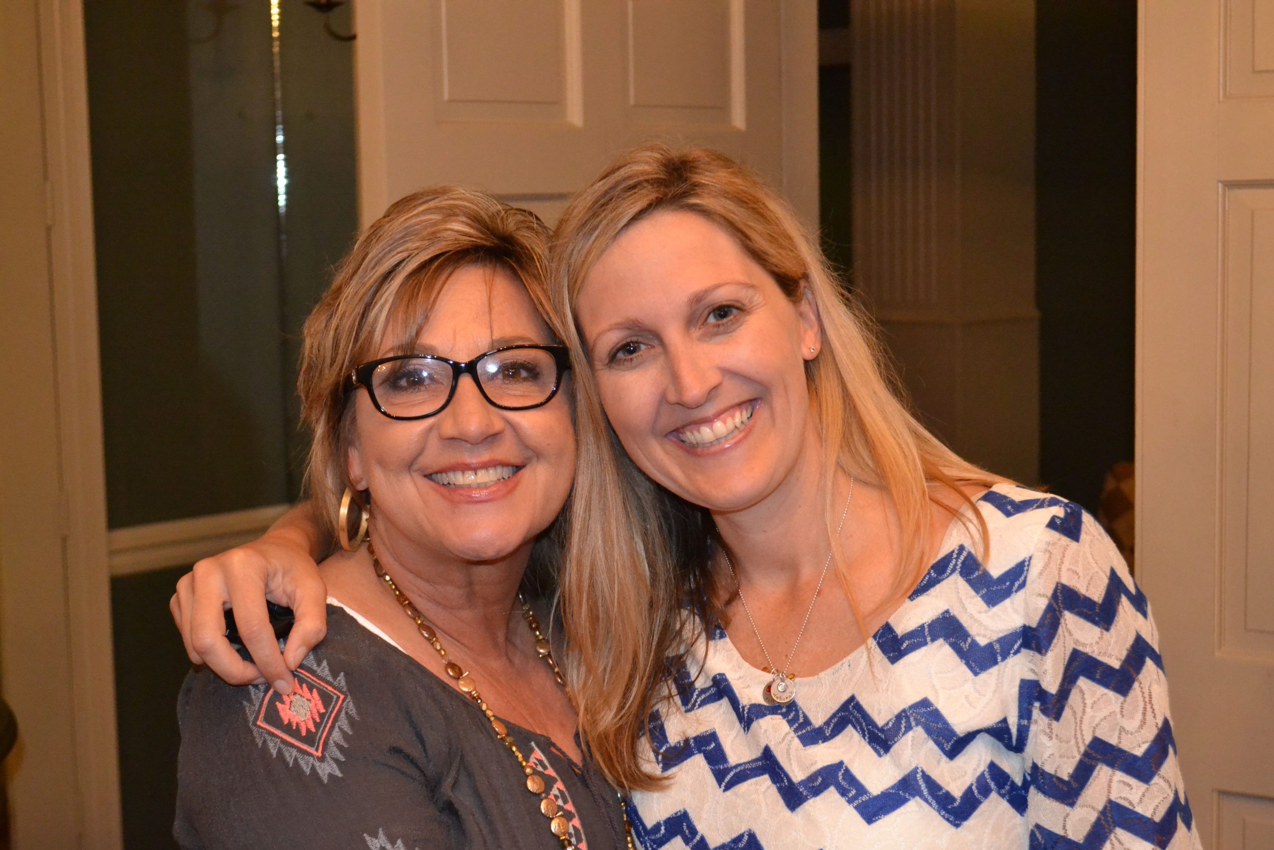 Two women with their arms around each other