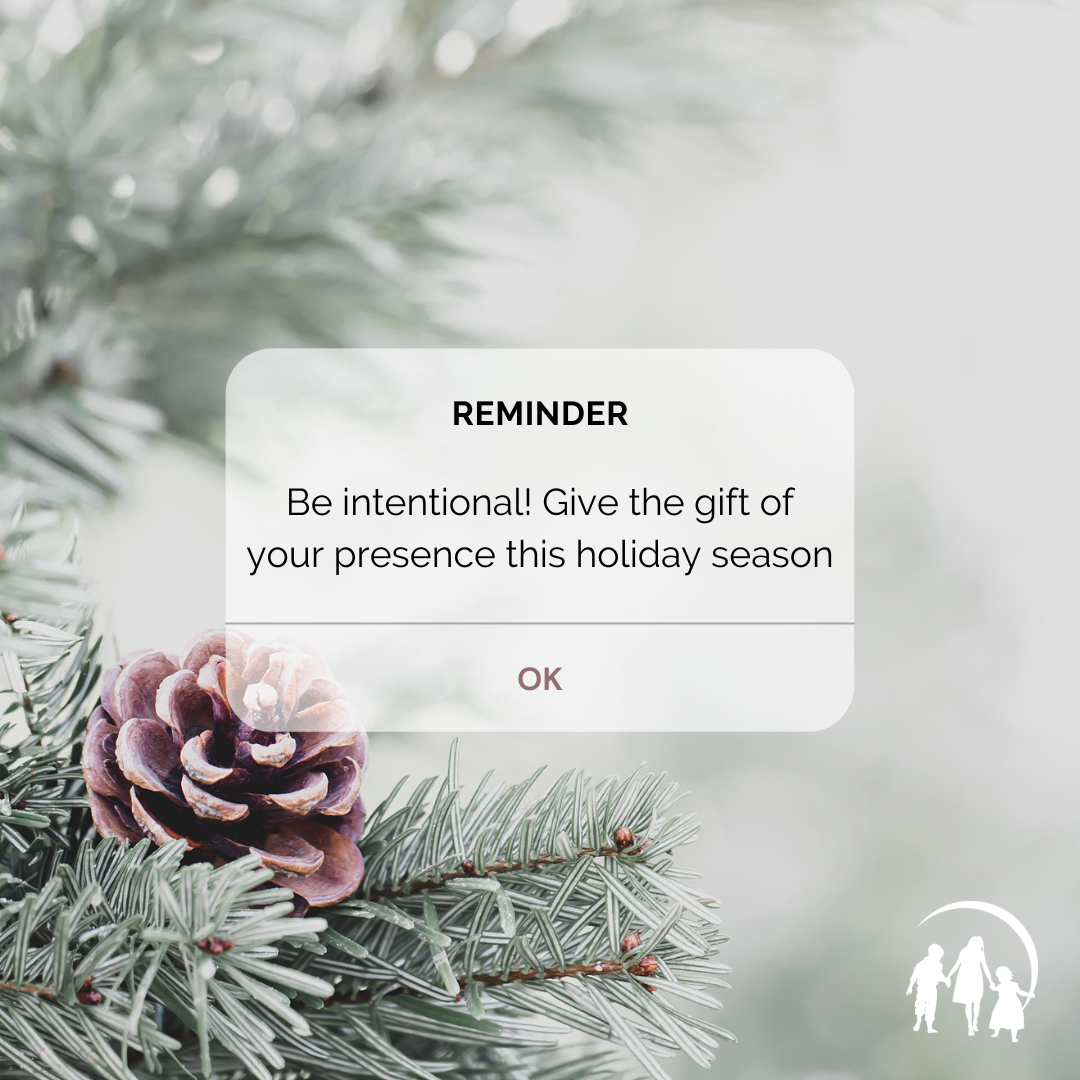 Christmas tree with reminder notification that says "be intentional. Give the gift of your presence this holiday season."