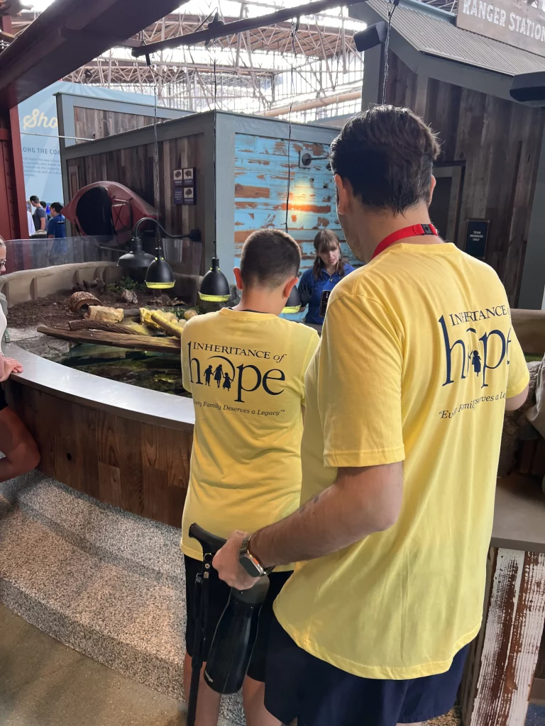 A father and son enjoying an aquarium