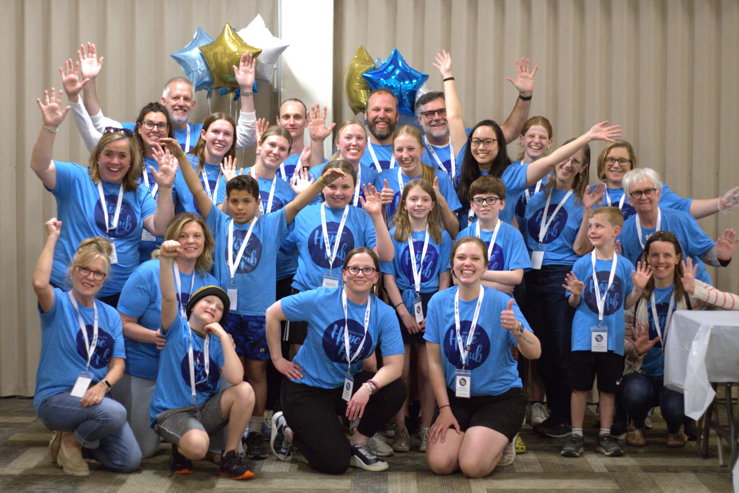 IMG_6261 Ellie Larsen A group photo in front of star shaped balloons