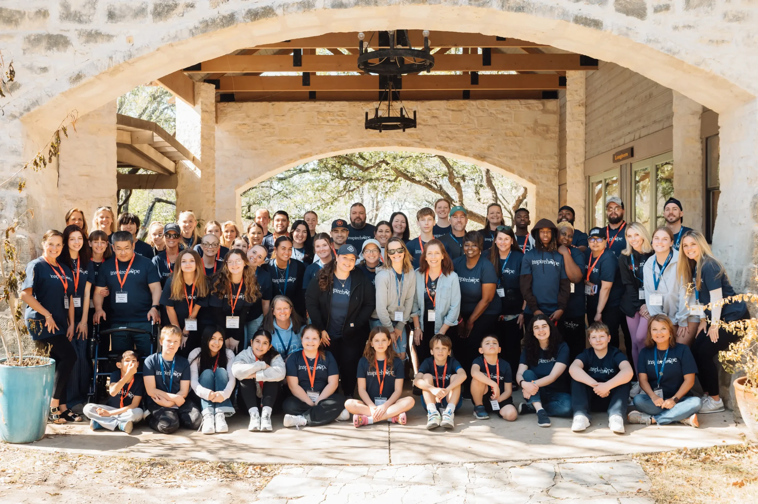 VGP_4293 A group picture of families and volunteers in inspire hope shirts