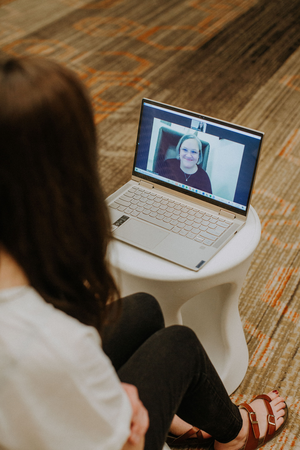 legacyvideos-00001 A woman sitting in from of a laptop on a video call with another woman