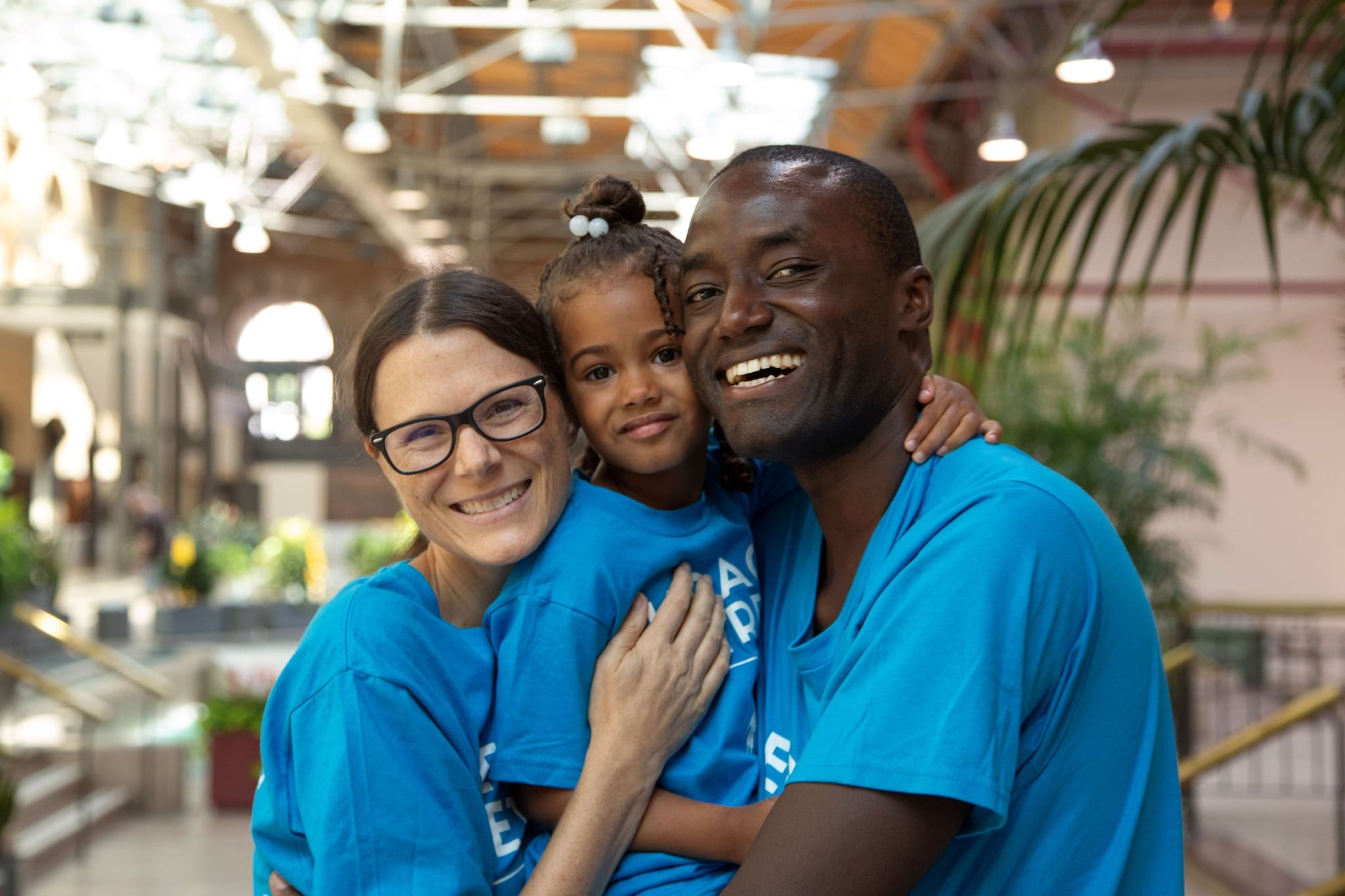 Family wearing matching blue shirts.