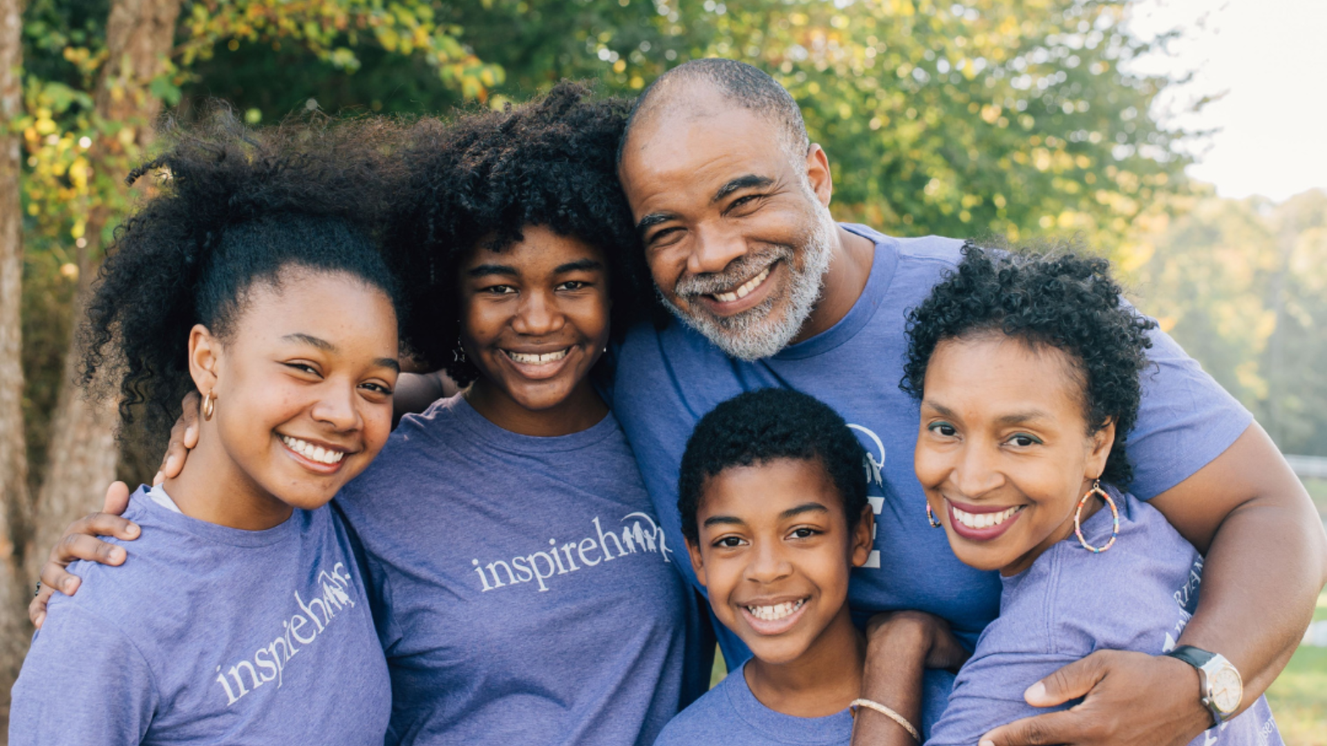 Feel Good Friday (wide 1920 x 1080) (2) Group of people in matching shirts.