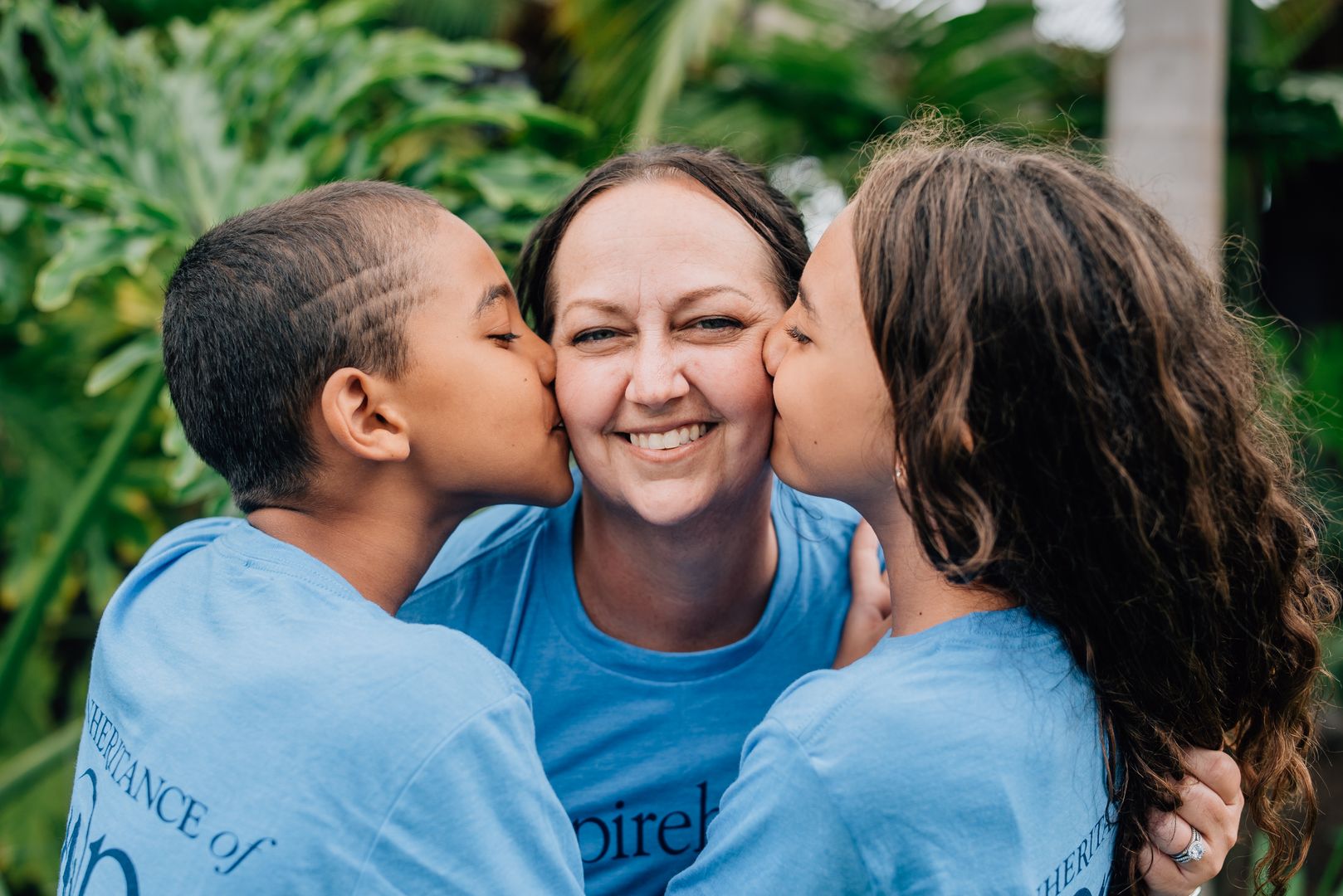 Family wearing matching blue shirts.