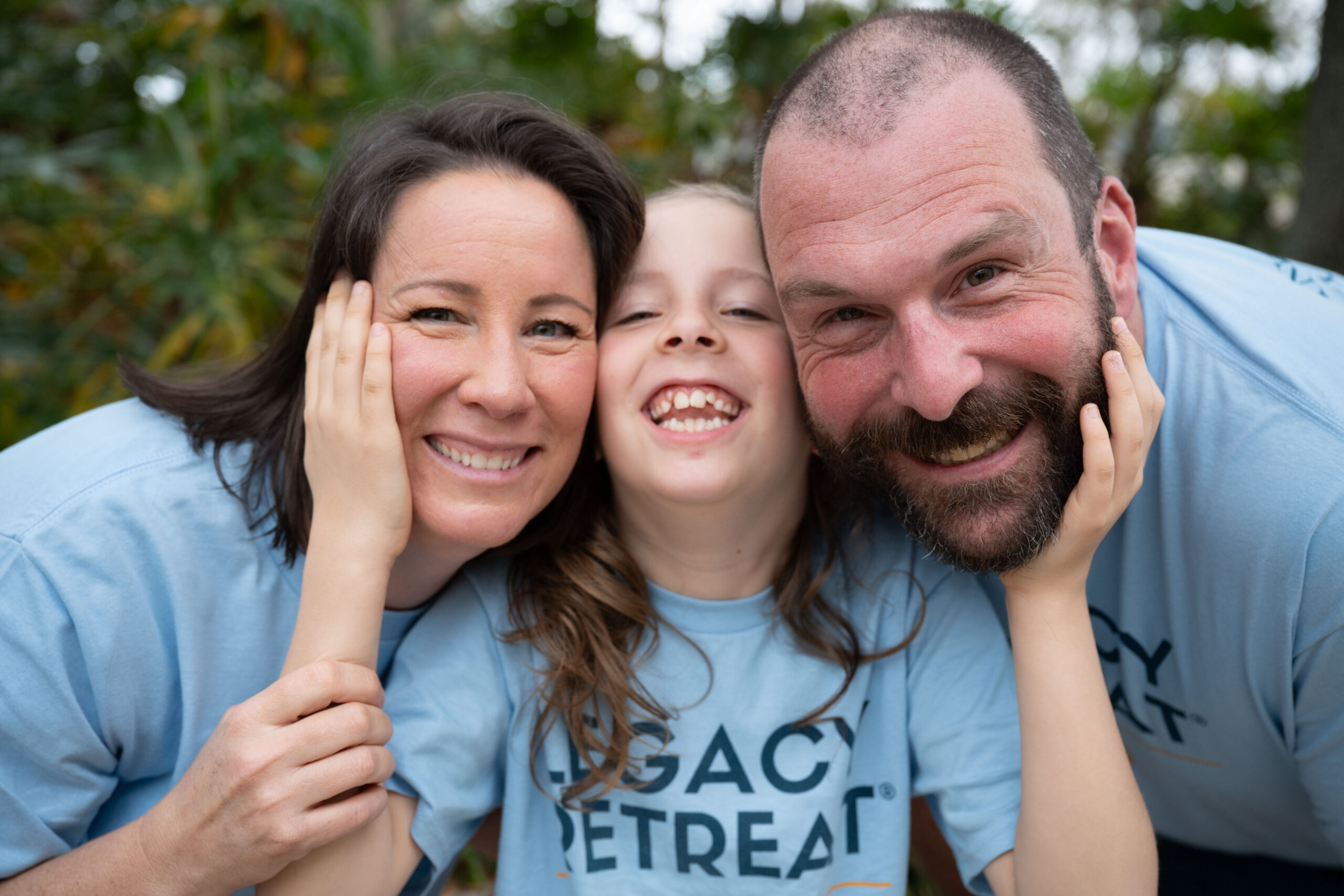 A family embracing and smiling