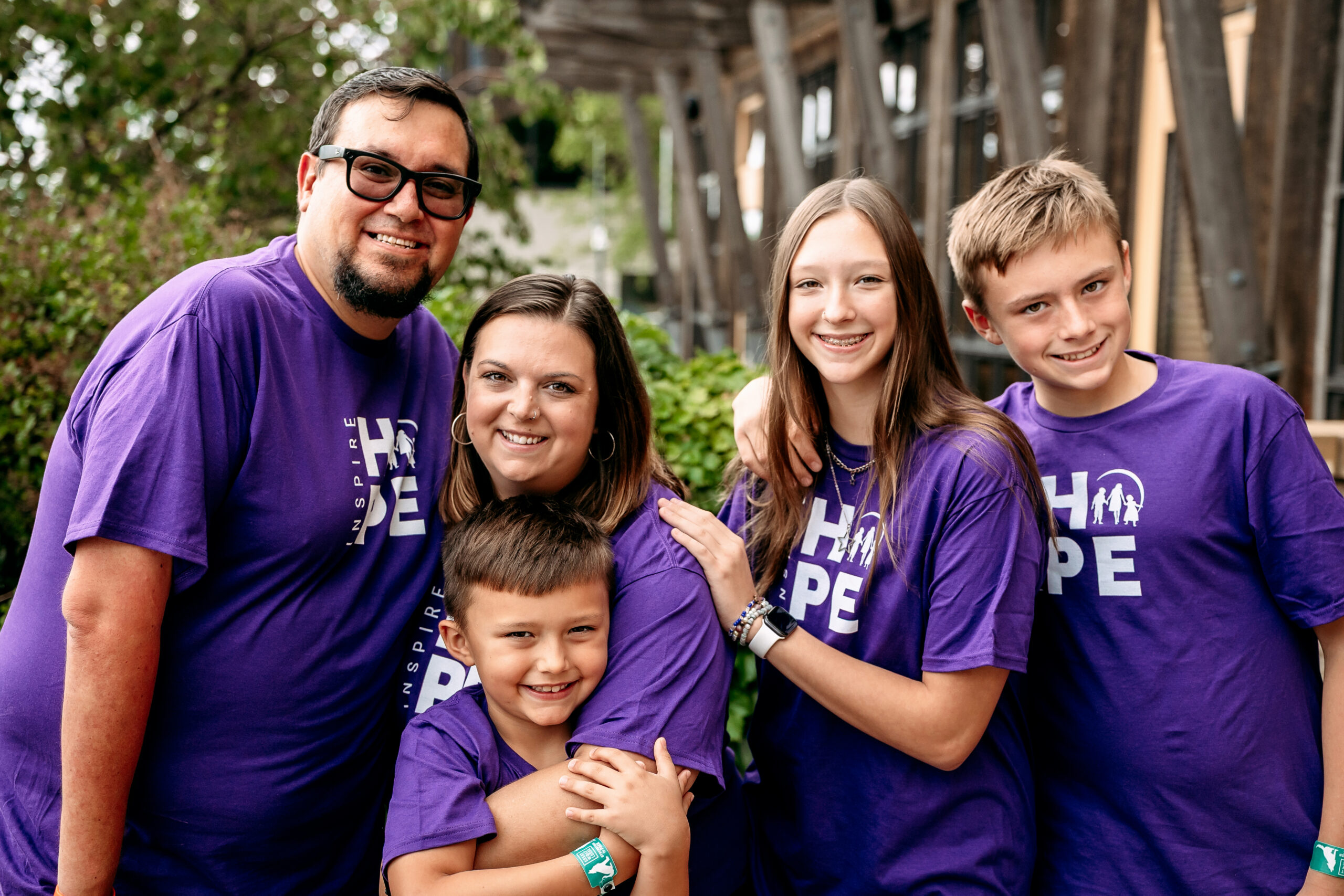 A family embracing and smiling