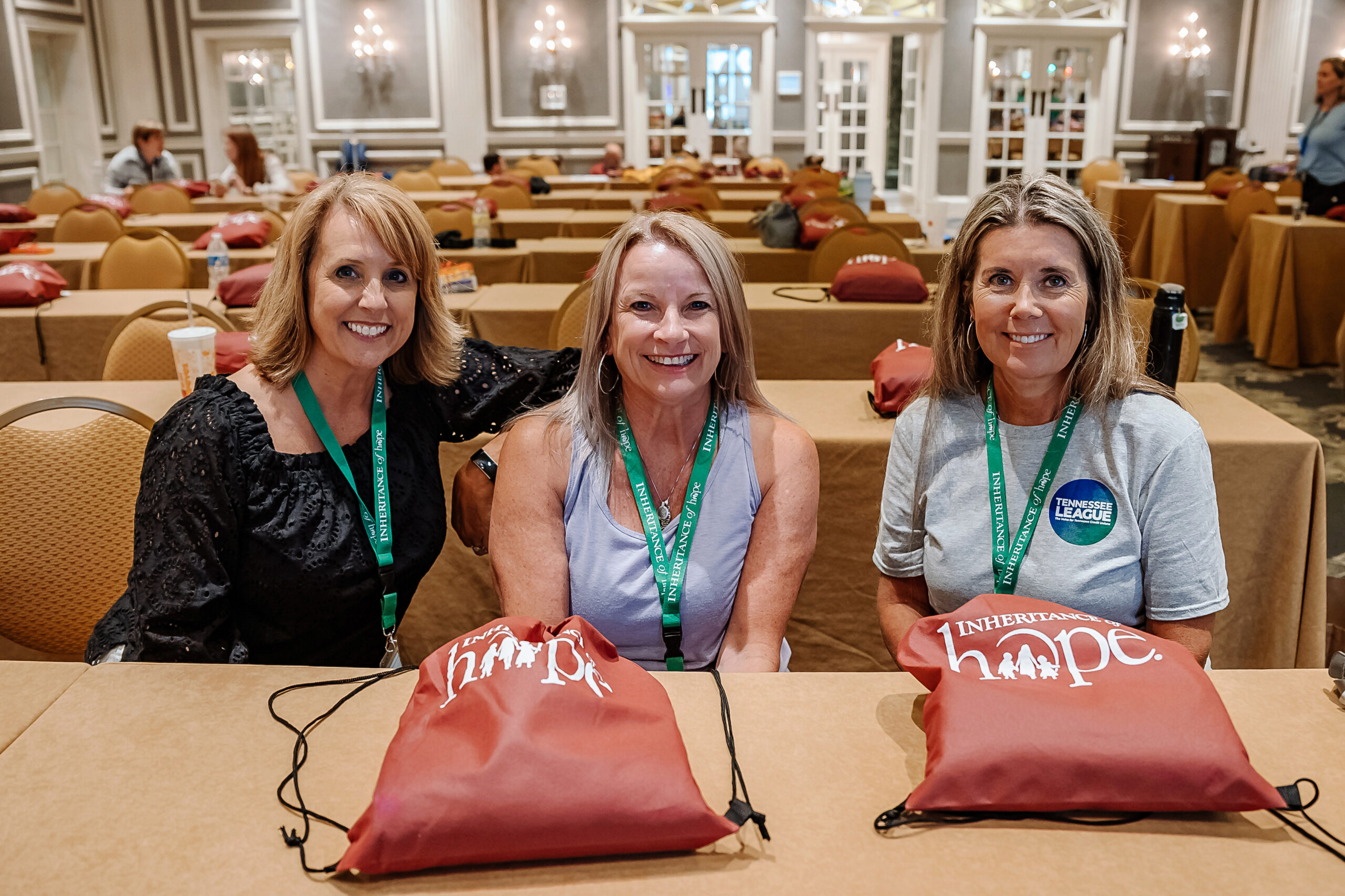 Three women smiling