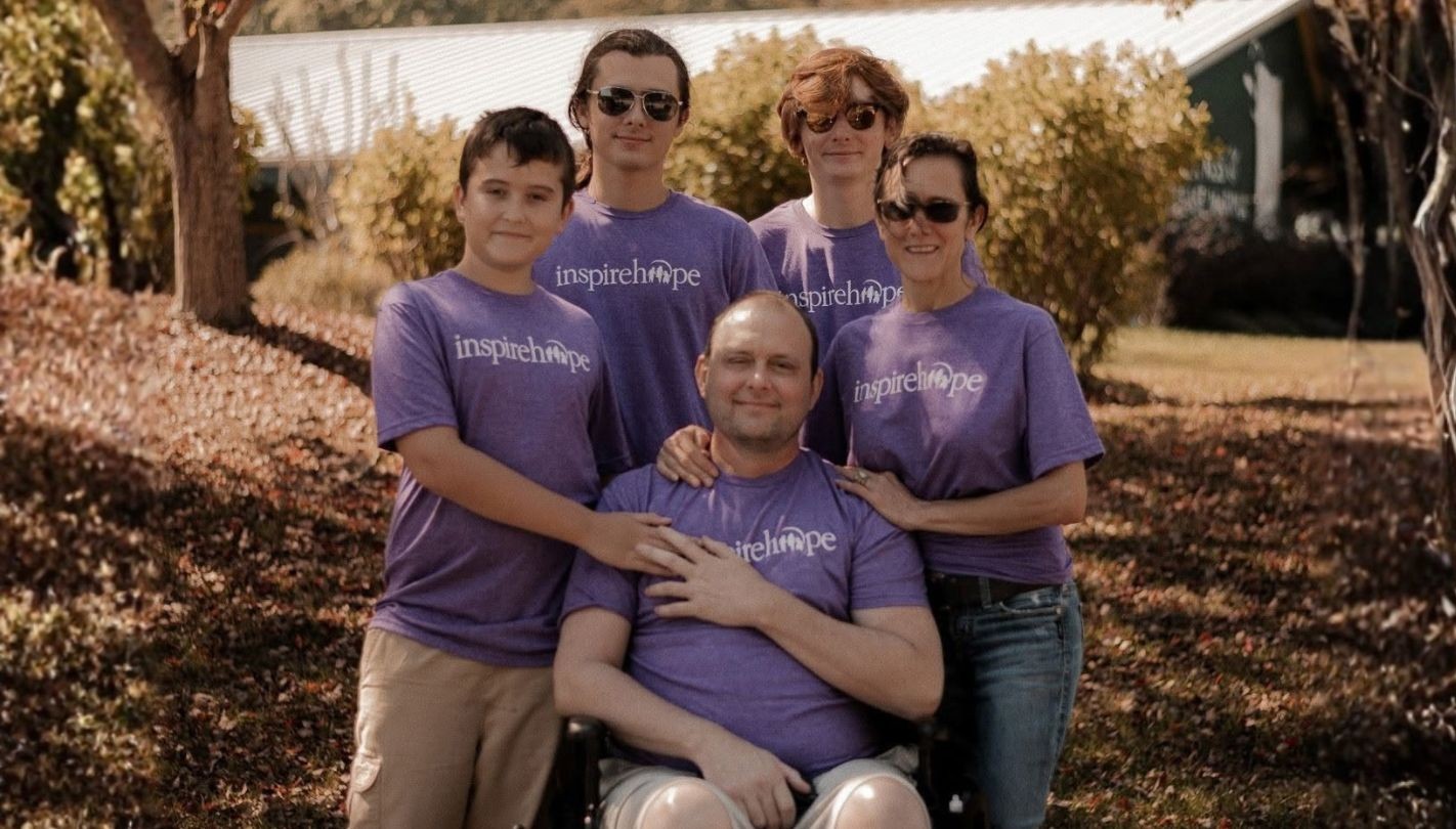 Feel Good Friday (wide_ 1920 x 1080) A dad in a wheelchair surrounded by his wife and young children